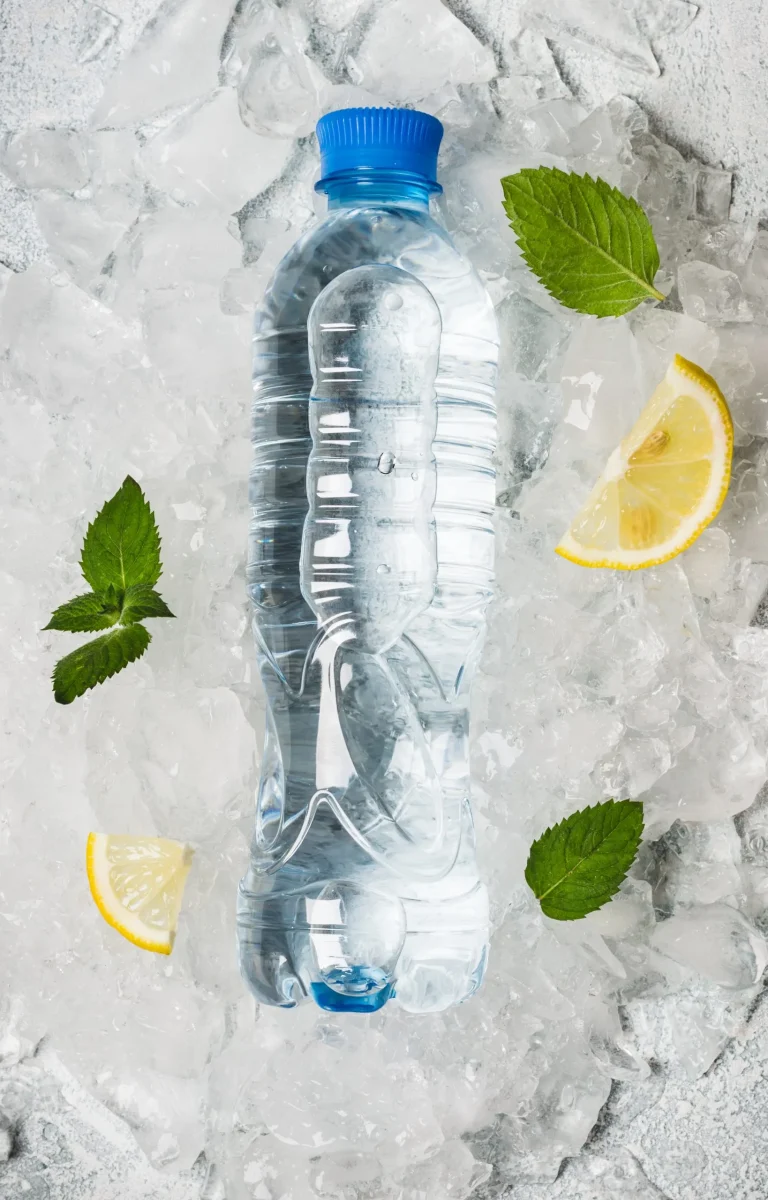 water in bottle on a background of ice.
